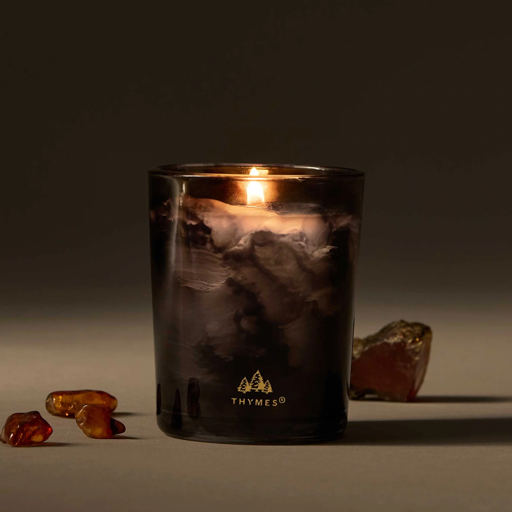 Noir Woods Votive Candle by Thymes